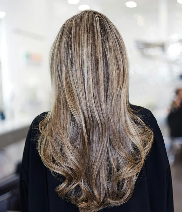 Image of a woman with a hair style and balayage